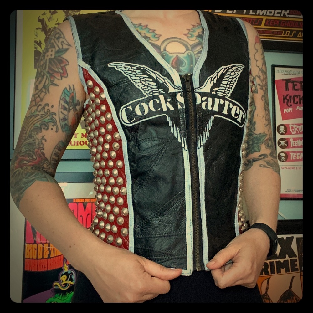 Hand painted leather vest with silver cone studs